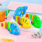 2025 Het rea gungande tecknad fiskleksak (slumpmässig färg)
